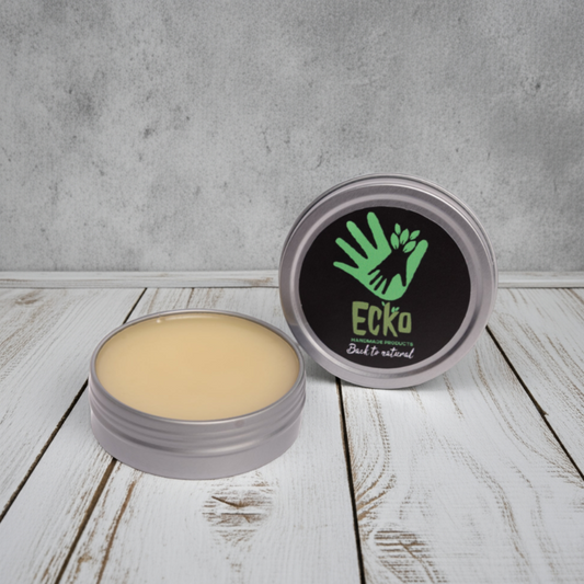 Cosmetic balm in a metal container with 'Ecko' branding on a wooden surface.